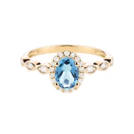 Złoty pierścionek z niebieskim topazem i diamentami TP0144ZNTZ