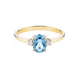 Złoty pierścionek z niebieskim topazem i diamentami TP0055ZNTZ
